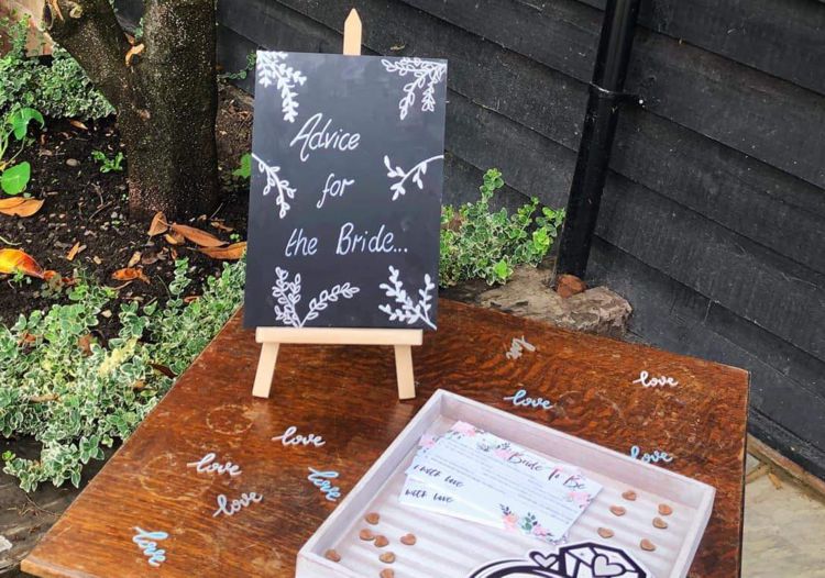 Small easel highlighting advice for the bride